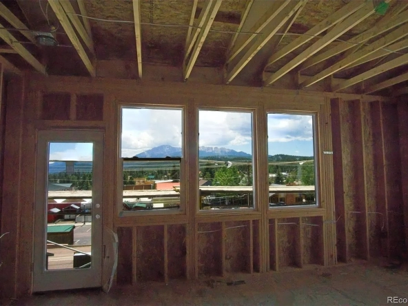 View of Pikes Peak from primary bedroom of 201 W Henrietta Ave townhome under construction in July 2025