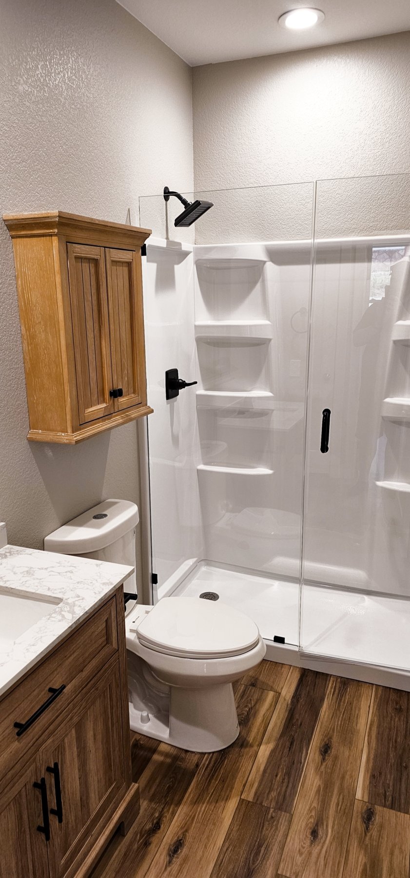 Downstairs bathroom with glass shower door