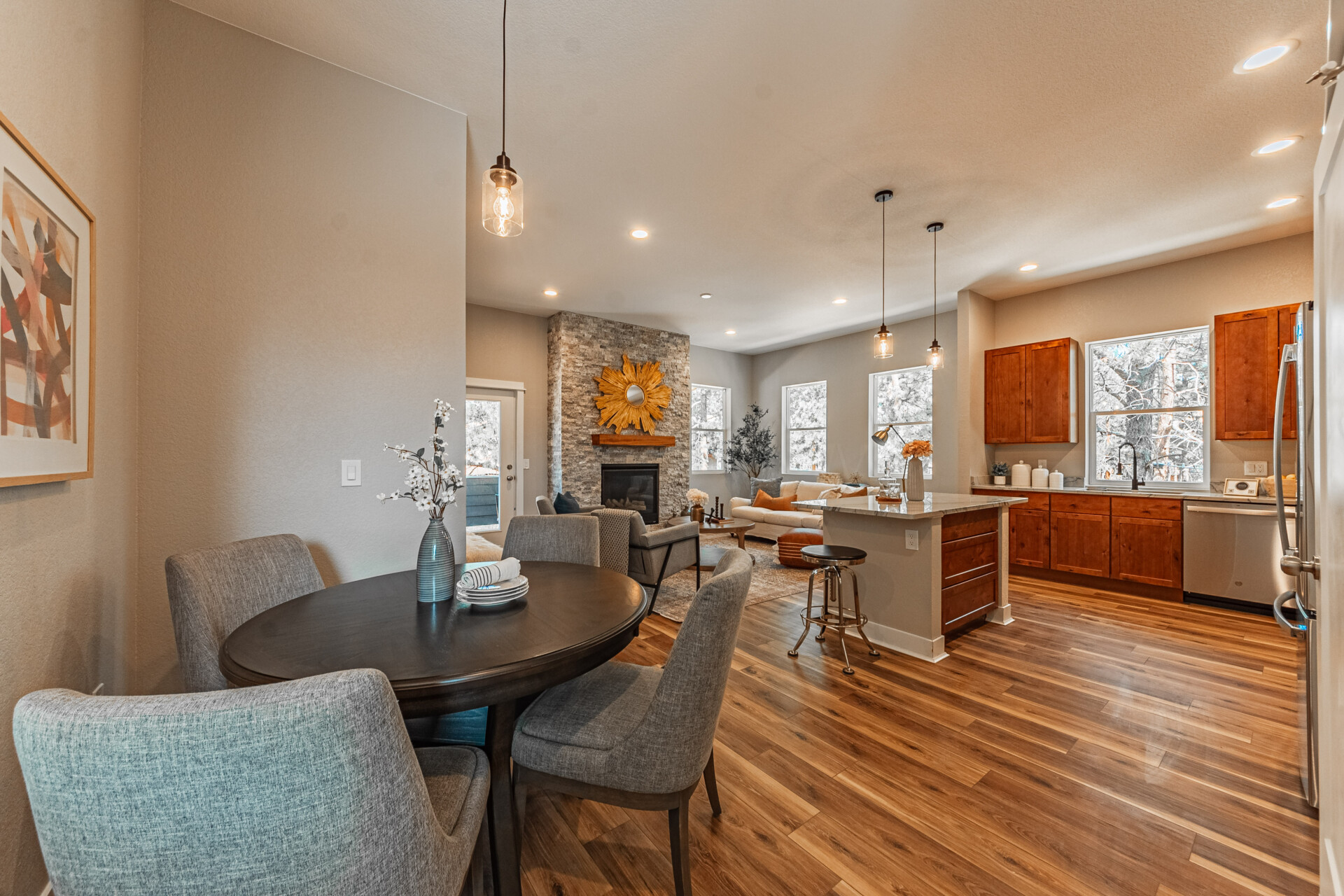 Dining area and Great Room with fireplace. Kitchen are on the right