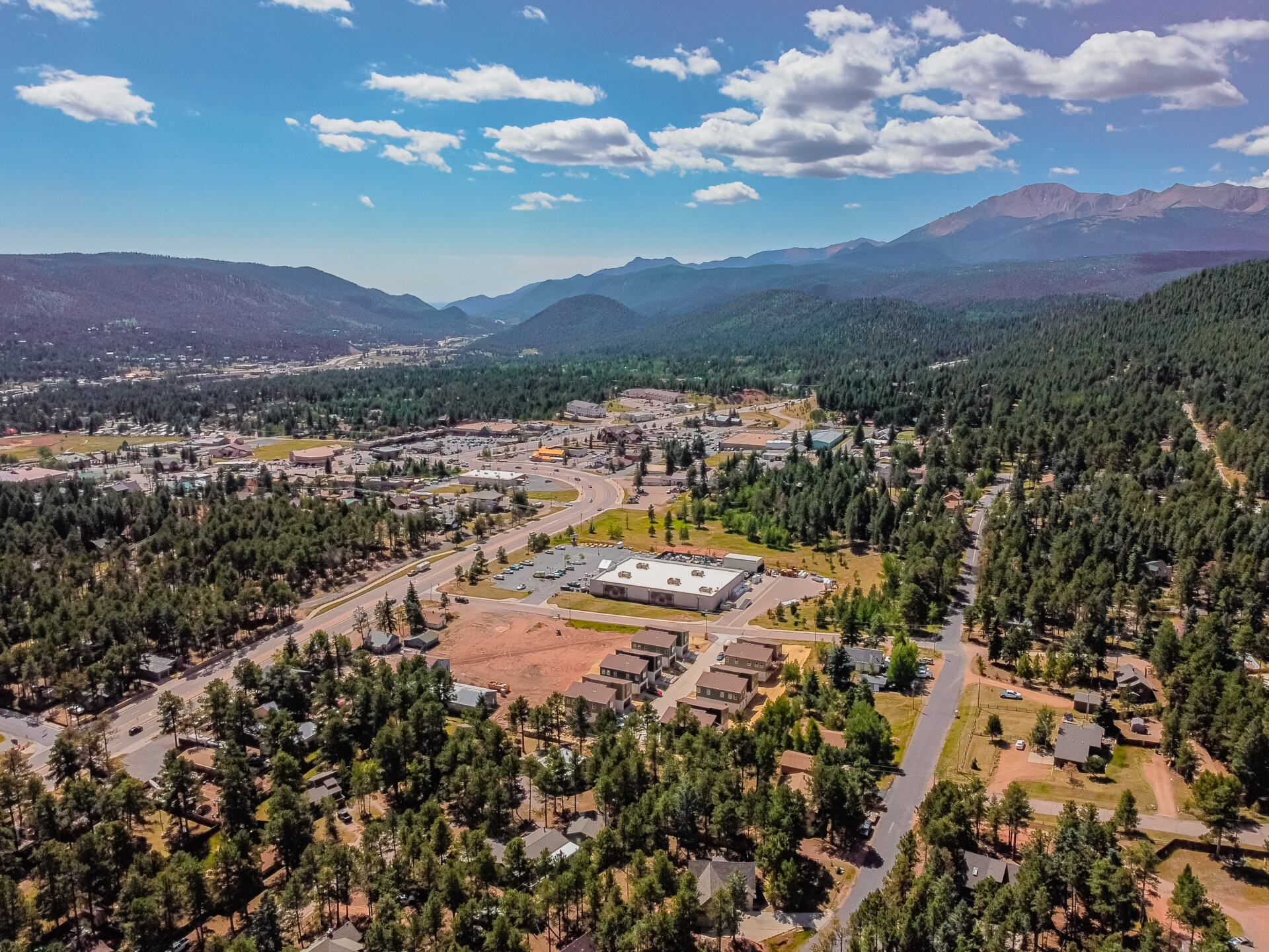 Aerial view of The Grove at Spruce Haven with Pikes Peak in the background