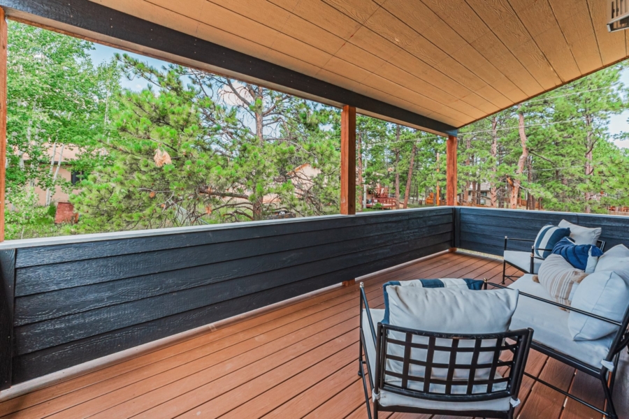 Outside covered deck surrounded by Ponderosa pines