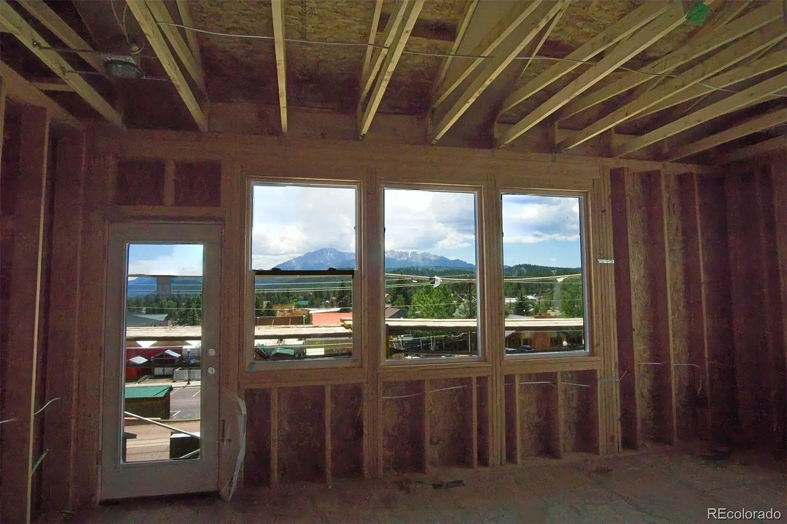 View of Pikes Peak from primary bedroom of 201 W Henrietta Ave townhome under construction in July 2025